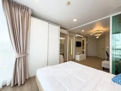 Spacious modern bedroom with large windows and elegant decor