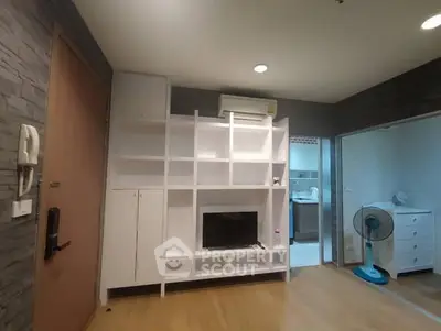Modern living room with built-in shelving and cozy lighting