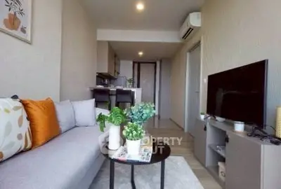 Modern living room with cozy seating and stylish decor in a contemporary apartment.