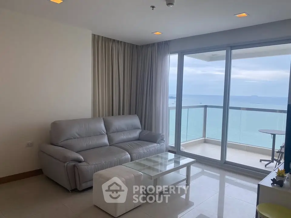 Spacious living room with ocean view balcony in modern apartment