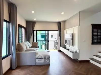 Spacious modern living room with large windows and stylish decor