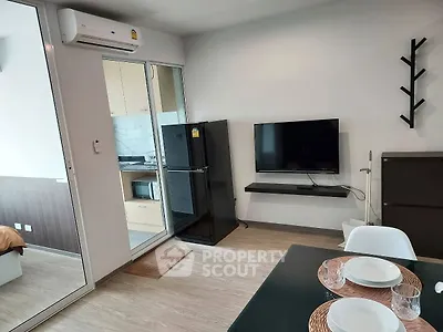 Modern apartment interior with sleek kitchen and cozy living area