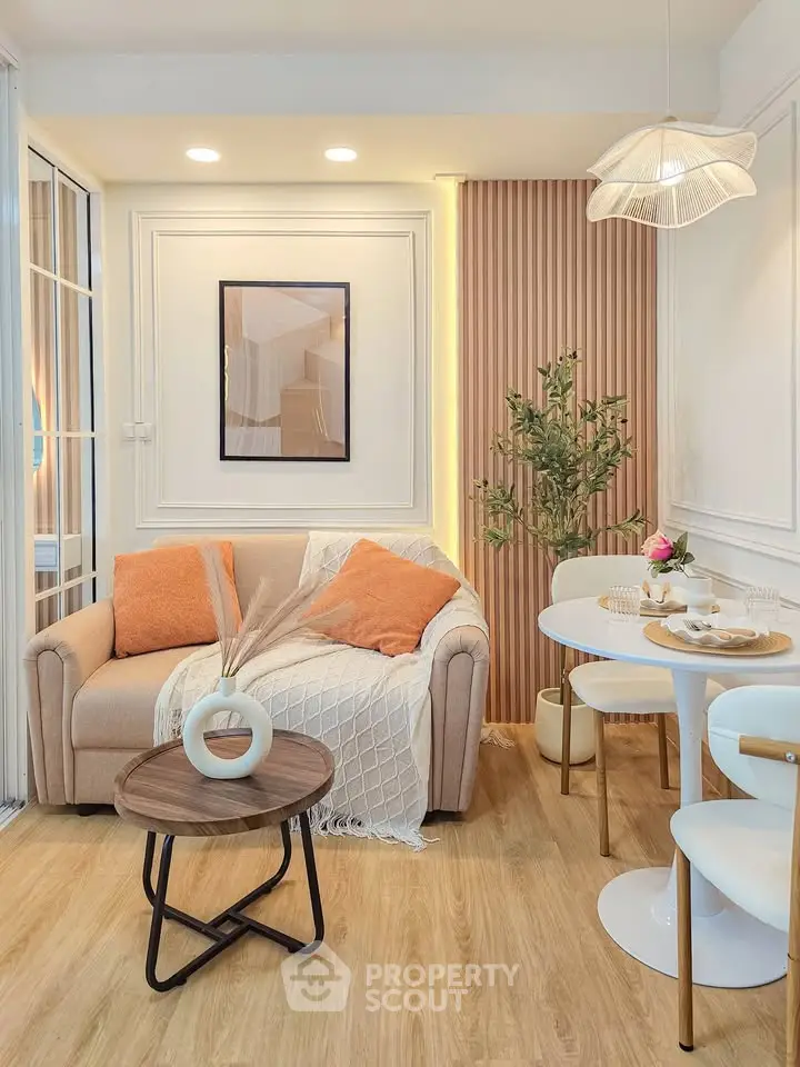 Chic modern living room with cozy sofa, stylish decor, and elegant dining area, perfect for urban living.