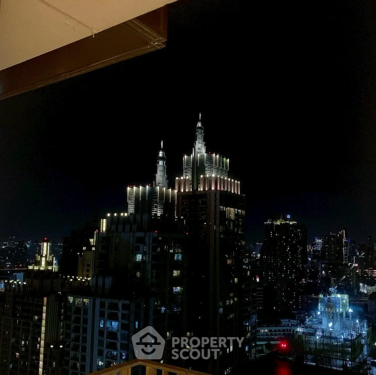Stunning night view of city skyline from high-rise balcony