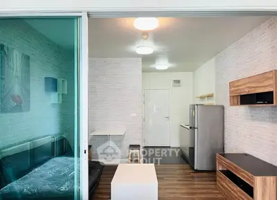 Modern open-plan living room with sleek kitchen and stylish decor