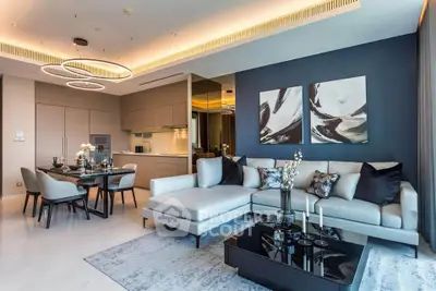 Luxurious modern living room with elegant decor and open kitchen layout, perfect for stylish urban living.