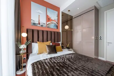 Luxurious bedroom with modern decor and plush bedding in a stylish apartment.
