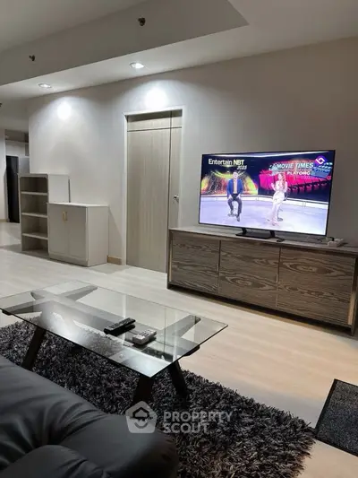 Modern living room with sleek furniture and entertainment setup