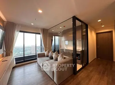 Modern living room with glass partition and balcony view, featuring sleek design and natural light.