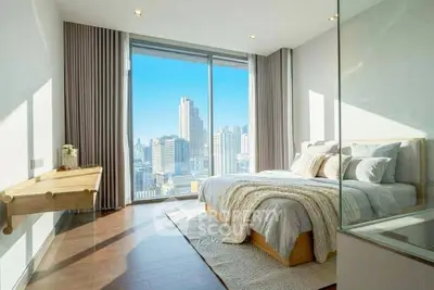 Luxurious bedroom with stunning city view and modern decor