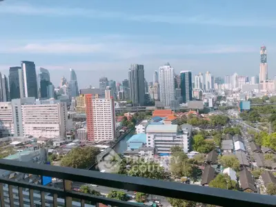 Stunning cityscape view from a high-rise balcony showcasing modern skyline and vibrant urban life.
