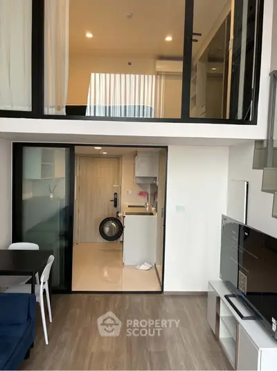 Modern duplex apartment with open living area and stylish interior design