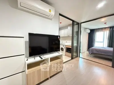 Modern apartment interior with open layout, featuring a living area, kitchen, and bedroom with sleek design.
