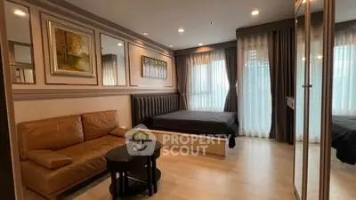 Modern bedroom with stylish decor and cozy seating area