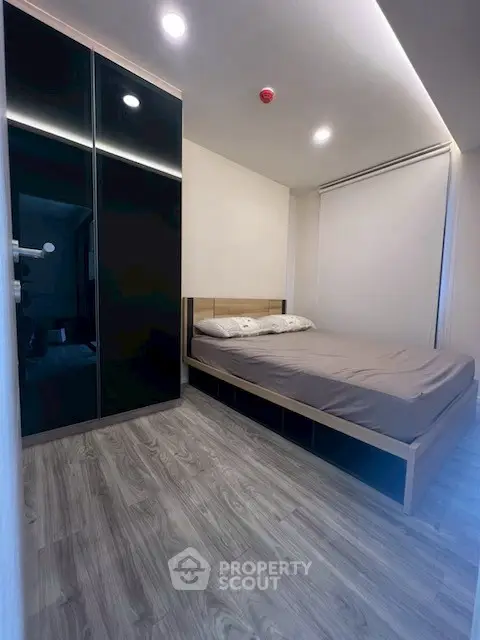 Modern bedroom with sleek design and ample storage space