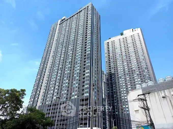 Stunning high-rise buildings with modern architecture against a clear blue sky.