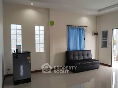 Spacious living room with modern sofa and natural light