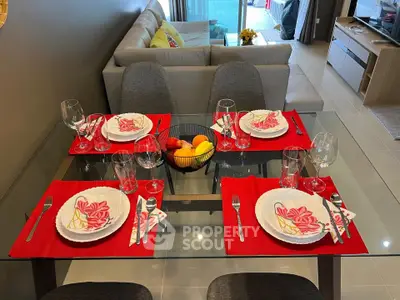 Modern dining area with elegant table setting in a stylish open-plan living room.