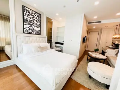Luxurious modern bedroom with elegant decor and cozy seating area