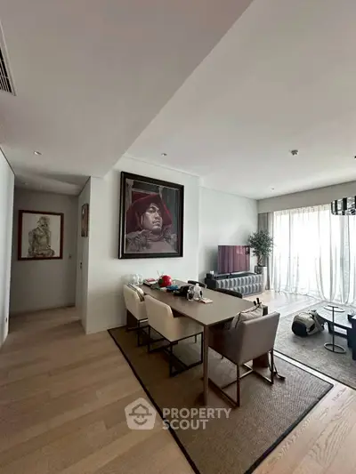 Elegant dining area with modern decor and natural light in a luxury apartment.