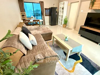 Spacious living room with modern decor and large sectional sofa
