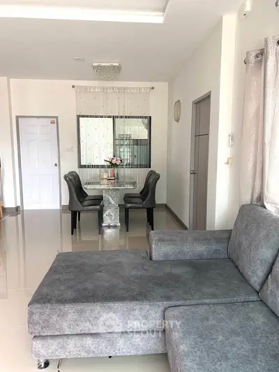 Modern living room with stylish dining area and elegant furnishings