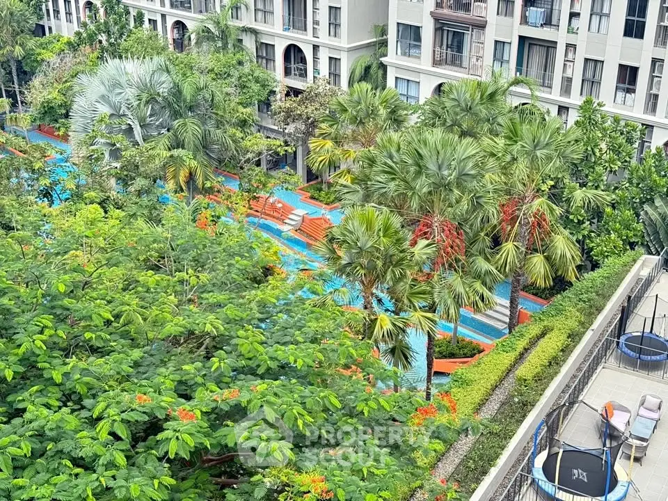 Luxurious residential complex with lush gardens and inviting pool area, perfect for relaxation and leisure.