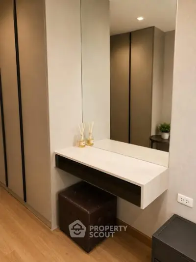 Modern bedroom with stylish vanity and elegant decor