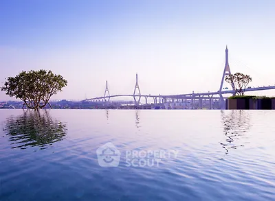 Stunning infinity pool with breathtaking bridge view, perfect for luxury living.