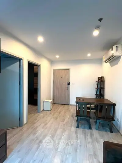 Modern apartment interior with wooden flooring and minimalist furniture