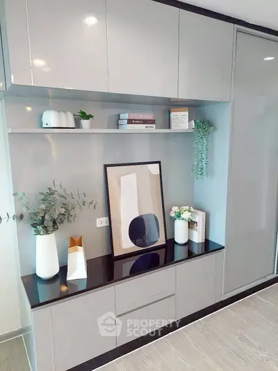 Modern interior with sleek cabinetry and stylish decor in a contemporary living space.