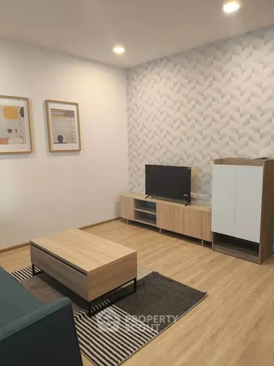 Modern living room with stylish decor and wooden furniture, featuring a sleek TV stand and contemporary artwork.