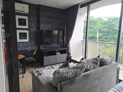 Modern living room with stylish decor and large balcony view