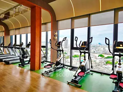 Luxurious gym with panoramic city views and modern fitness equipment