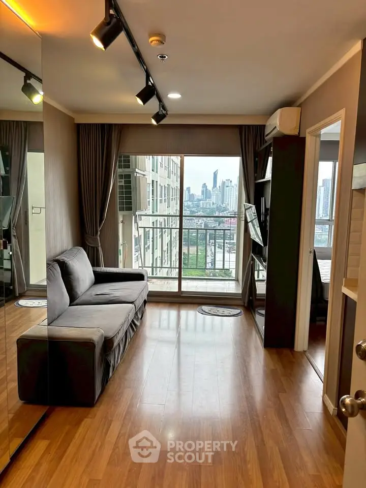Modern living room with city view, featuring sleek design and cozy ambiance, perfect for urban living.