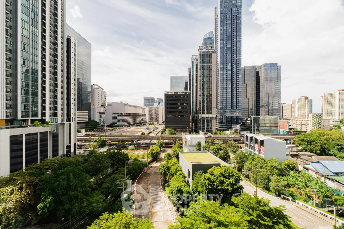 Stunning cityscape view with modern skyscrapers and lush greenery, perfect for urban living enthusiasts.