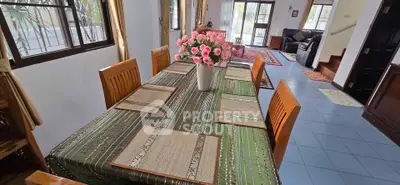 Spacious living room with elegant dining area and stylish decor