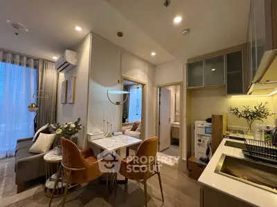 Modern open-plan living and dining area with elegant decor and natural light