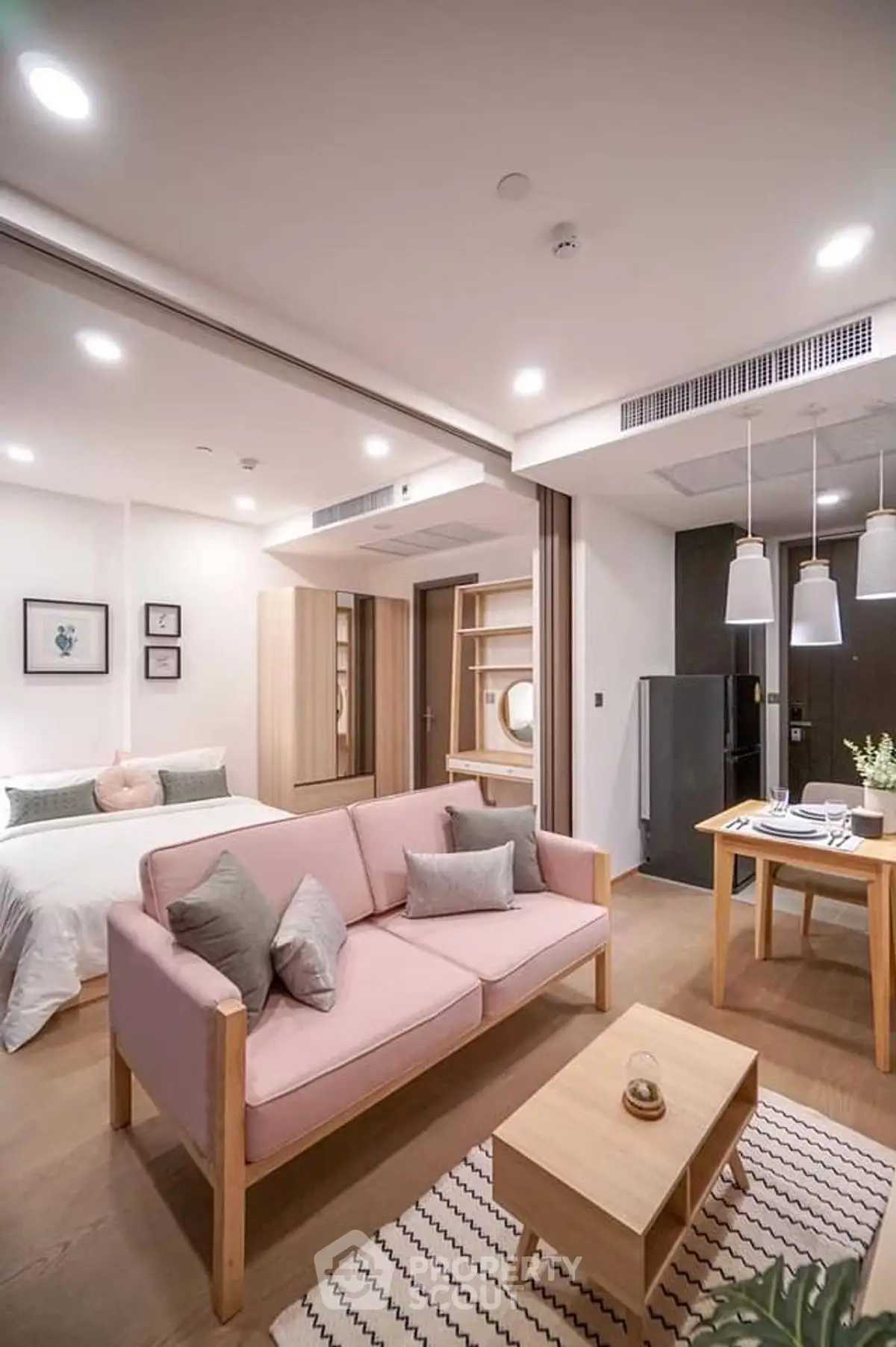 Modern open-plan studio with cozy living area and stylish decor