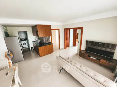Spacious modern living room with open kitchen and sleek furnishings