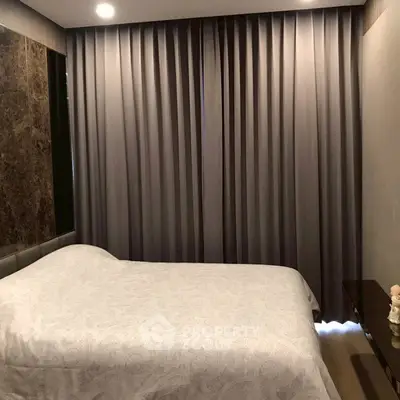 Cozy bedroom with elegant curtains and modern decor