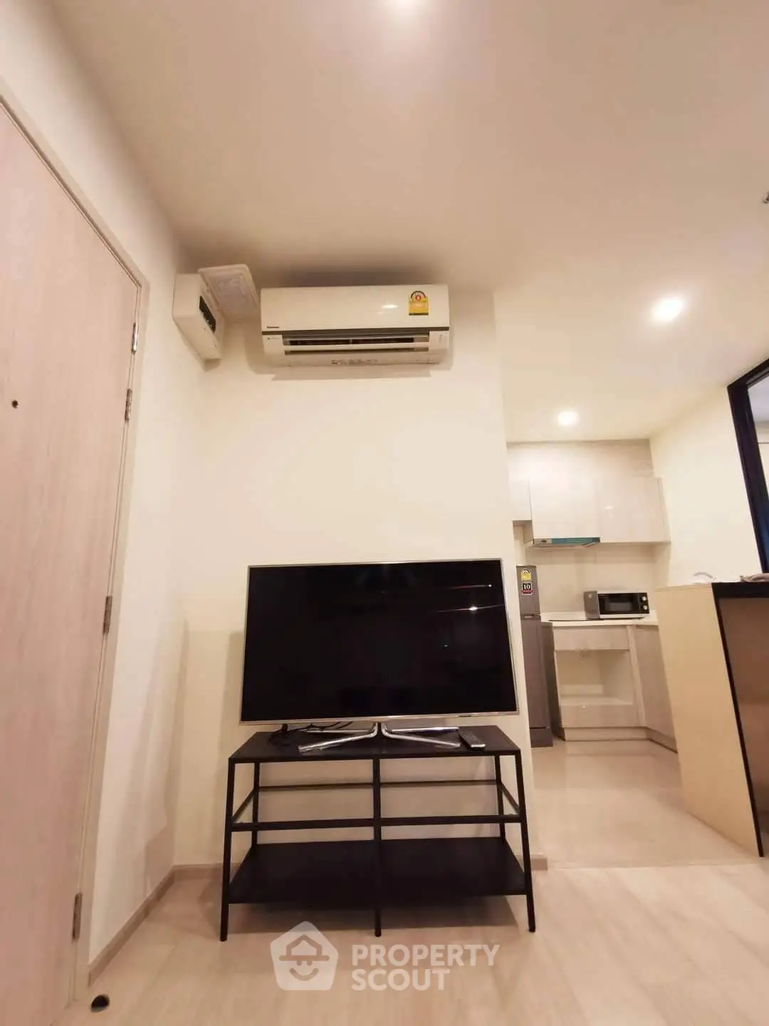 Modern living room with air conditioning and sleek TV setup