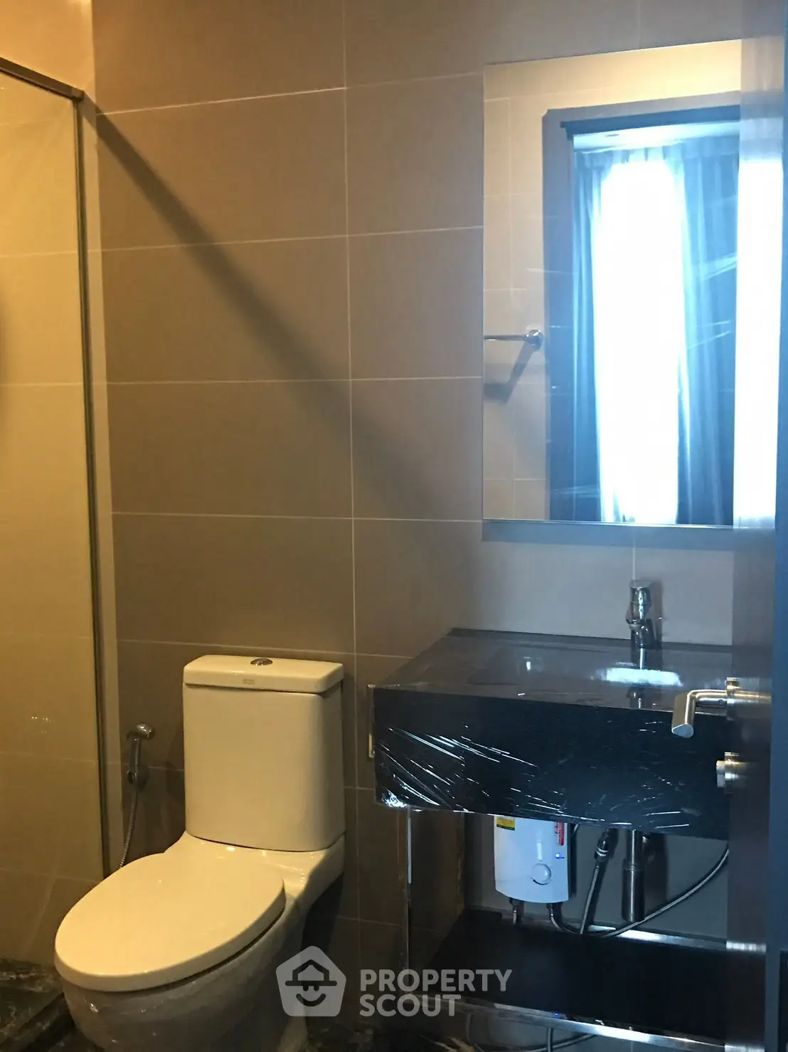 Modern bathroom with sleek fixtures and large mirror