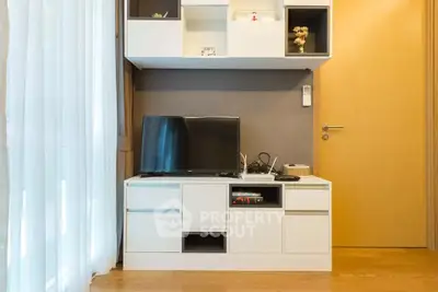 Modern living room with sleek TV unit and stylish decor