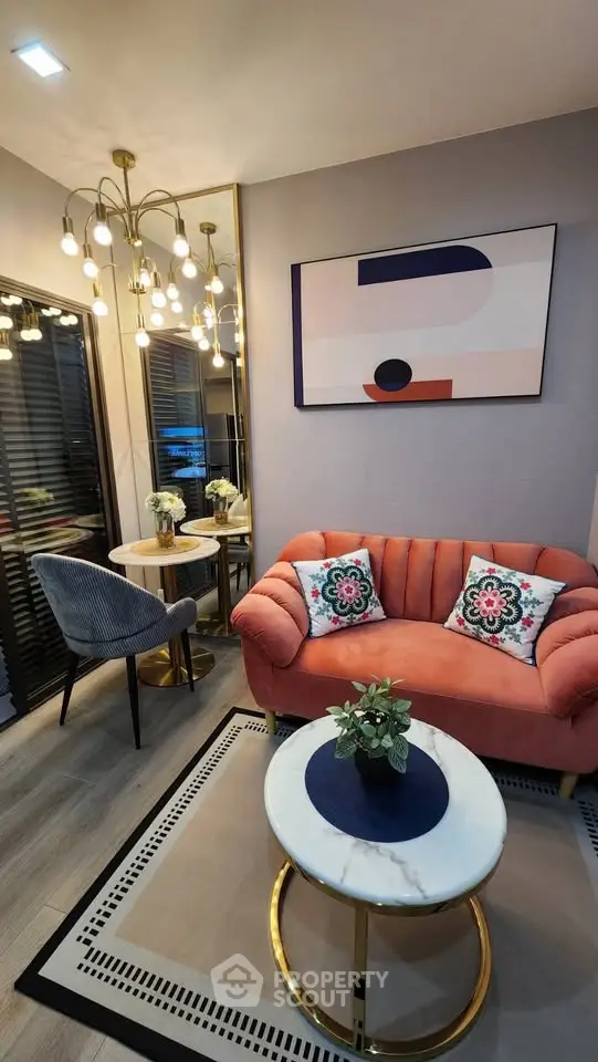Stylish living room with modern decor, featuring a plush sofa, chic lighting, and elegant coffee table.