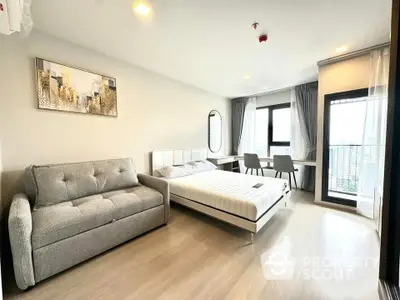 Modern bedroom with city view, featuring stylish decor and spacious layout.