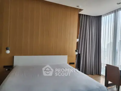Modern bedroom with floor-to-ceiling windows and stylish wooden accent wall