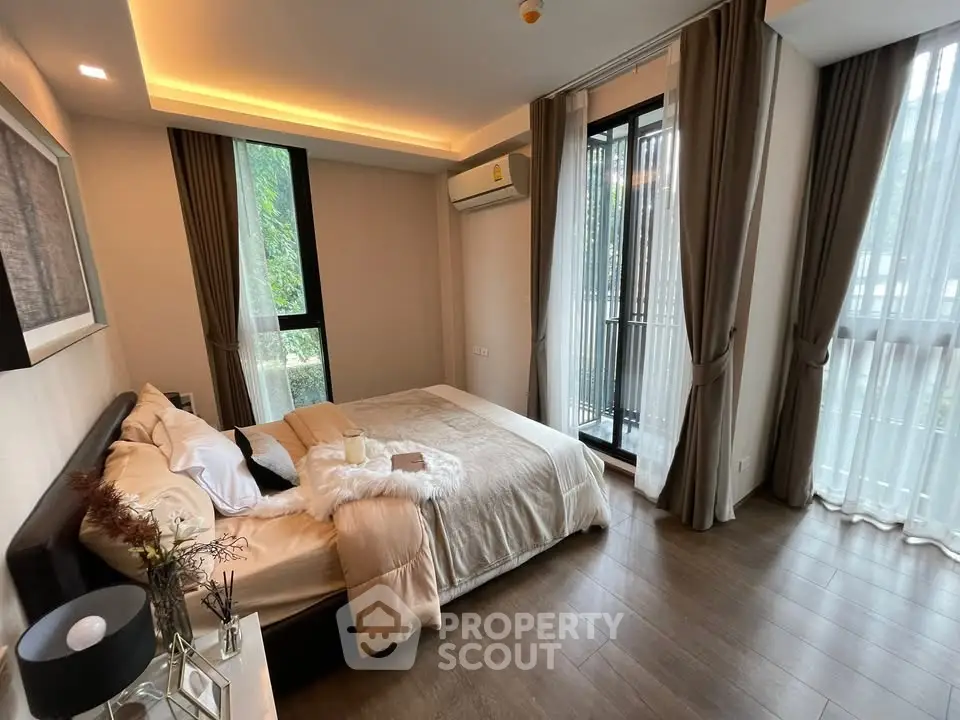 Modern bedroom with large windows and elegant decor