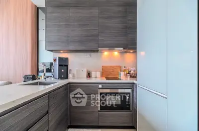 Modern kitchen with sleek cabinetry and built-in appliances