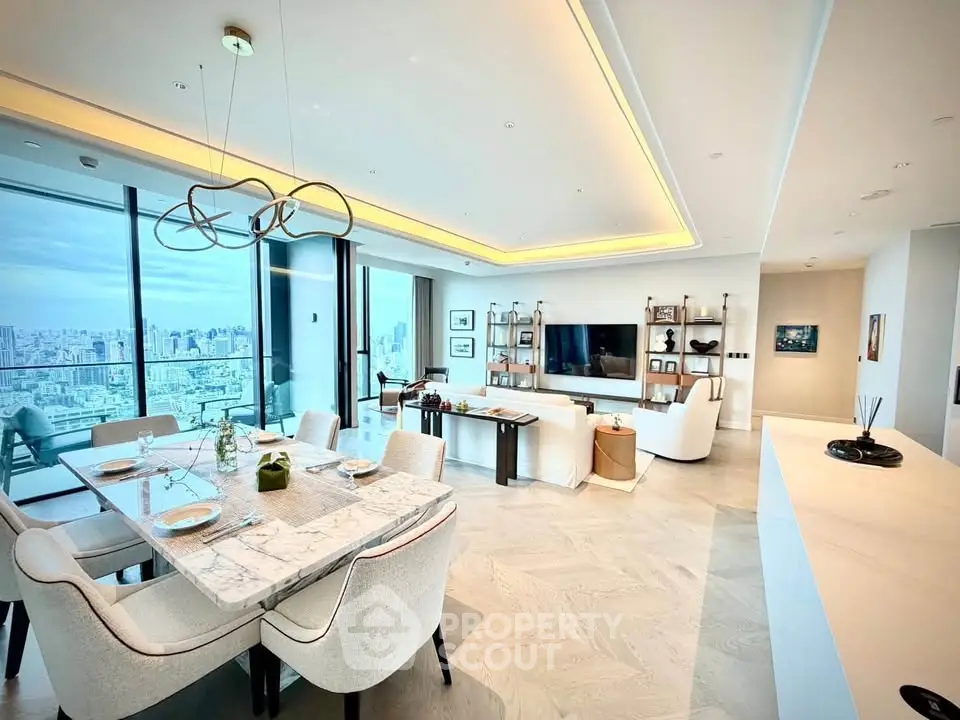 Luxurious open-plan living and dining area with stunning city views and modern decor.